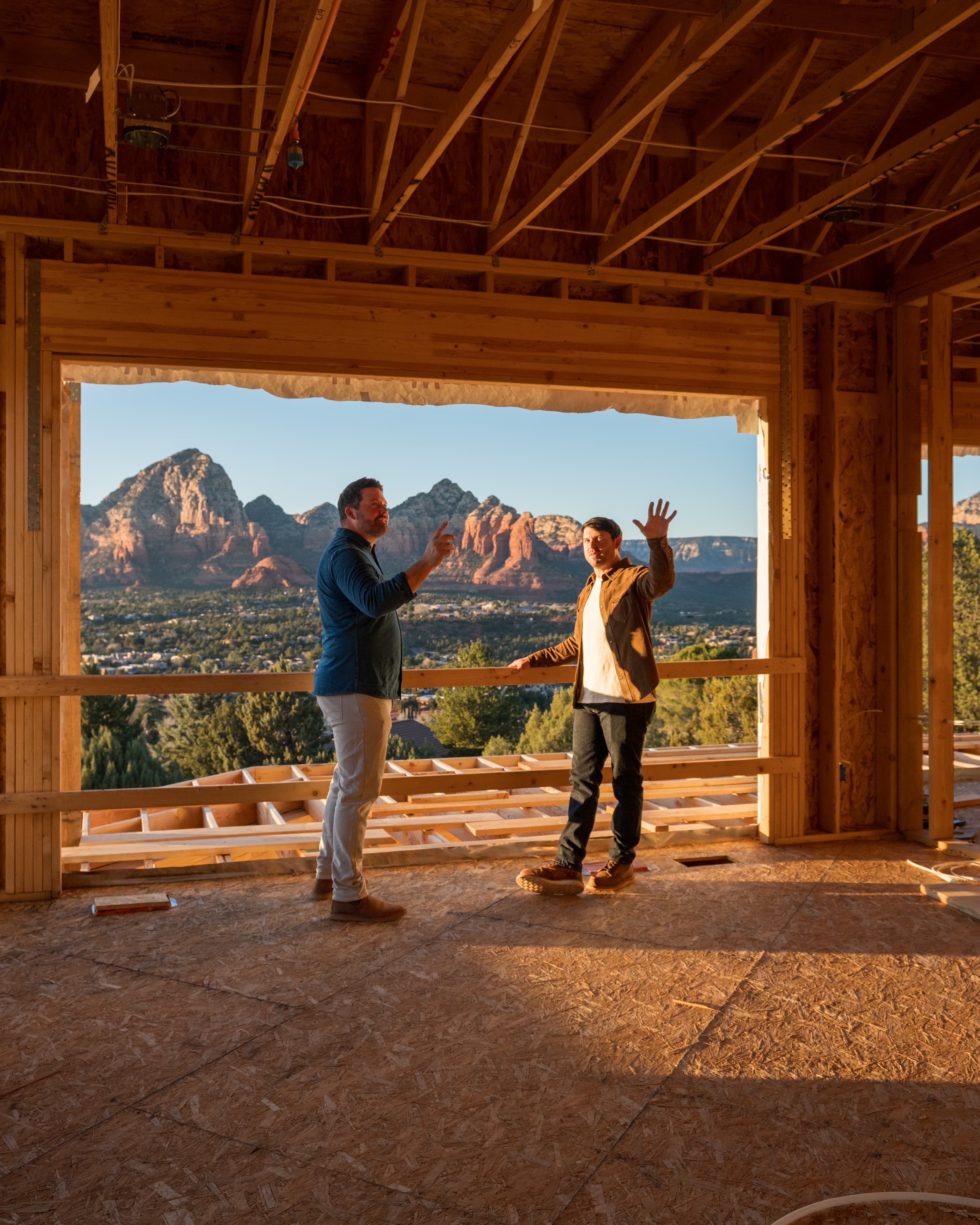 Wyatt team on job site reviewing plans with Sedona red rocks